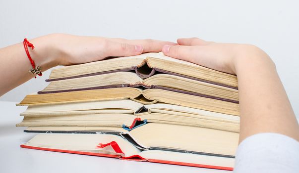 A  pile of books and a calculator help in learning.