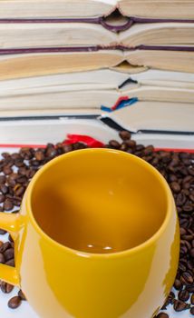 A  pile of books calculator and coffee help in learning.
