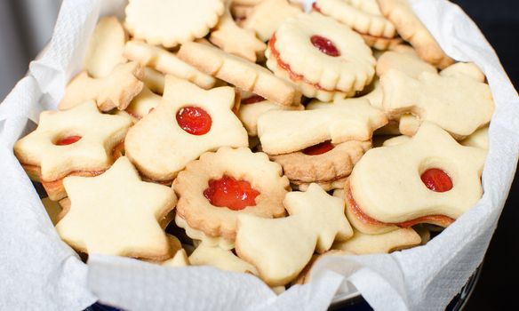 Cutting and baking Christmas cookies in Advent Time.