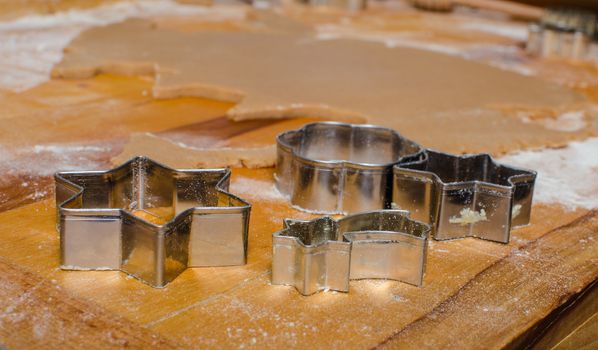 Cutting and baking Christmas gingerbread in Advent Time