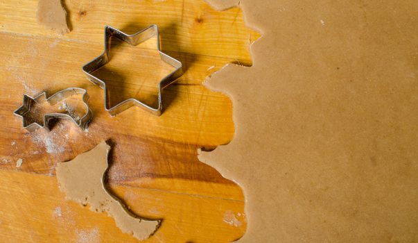 Cutting and baking Christmas gingerbread in Advent Time