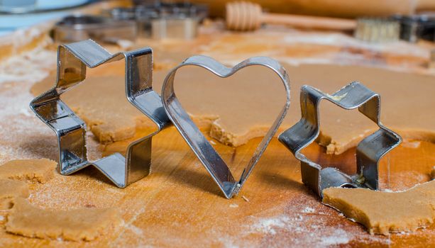 Cutting and baking Christmas gingerbread in Advent Time