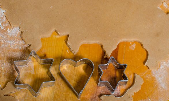 Cutting and baking Christmas gingerbread in Advent Time