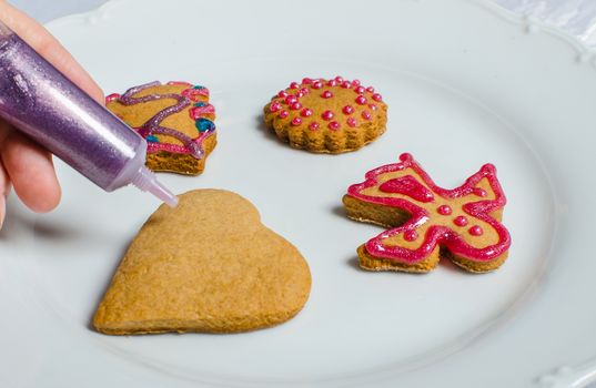 Cutting and baking Christmas gingerbread in Advent Time