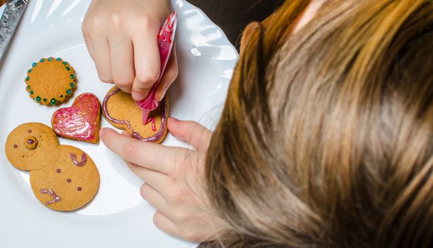 Cutting and baking Christmas gingerbread in Advent Time
