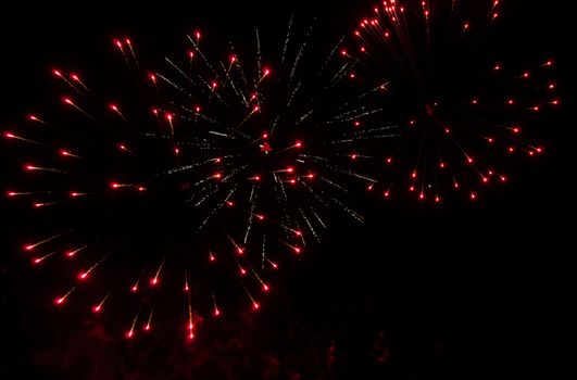 Colorful fireworks in the clouds and the beginning of Christmas time