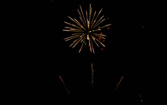 Colorful fireworks in the clouds and the beginning of Christmas time