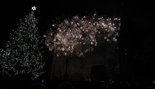 Colorful fireworks in the clouds and the beginning of Christmas time