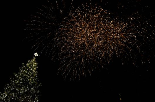 Colorful fireworks in the clouds and the beginning of Christmas time