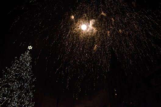 Colorful fireworks in the clouds and the beginning of Christmas time