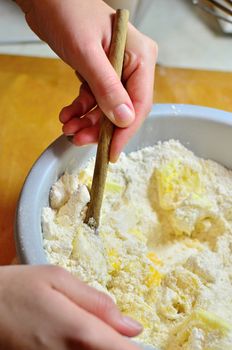 Hands baking Christmas cookies and biscuits.