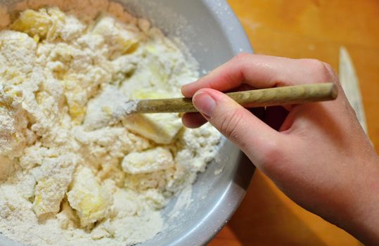 Hands baking Christmas cookies and biscuits.