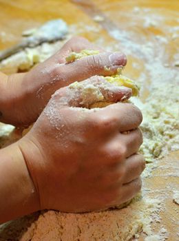 Hands baking Christmas cookies and biscuits.