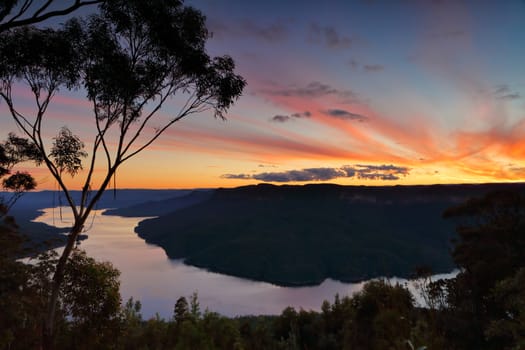 Sunset views over the pristine wilderness of  Lake Burragorang and valley in Nattai,  Blue Mountains National Park.  Lake Burragorang consists of water from Coxs, Kowmung, Nattai, Wingecarribee, Wollondilly, and Warragamba rivers and their associated tributaries. 