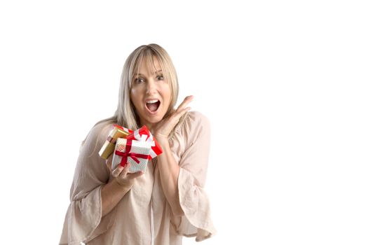 Surprised woman holding wrapped gifts tied with ribbon. White background suitable image for Christmas, birthday, valentine or other event