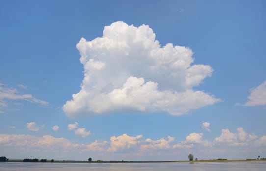 Cloud on blue sky on Danube river