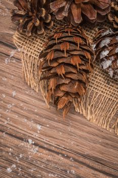 Christmas wooden background with pines. Top view.