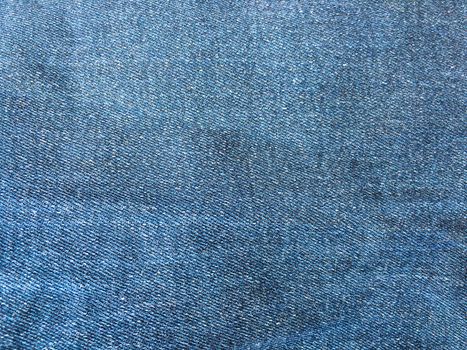 Denim jeans background, Jeans texture, denim fabric. Blue background