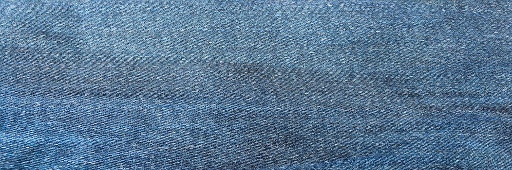 Denim jeans background, Jeans texture, denim fabric. Blue background