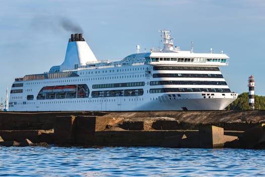 White cruise liner in Riga city. Tour travel and spa services