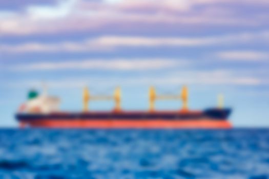 Cargo ship - soft lens bokeh image. Defocused background