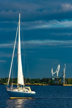 Blue sailboat in the travel by Europe. Sea journey