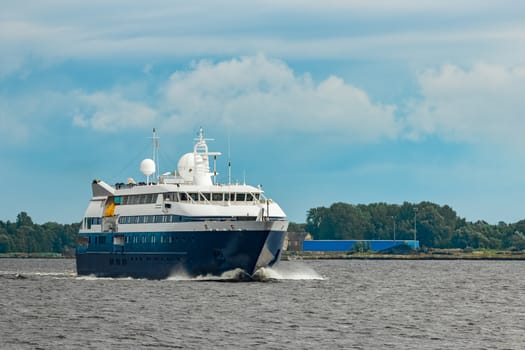 Small blue passenger ship sailing in Baltic sea. Spa services