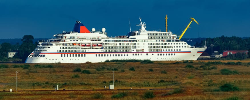 White cruise liner in Riga city. Tour travel and spa services