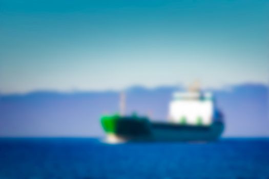 Cargo ship - soft lens bokeh image. Defocused background