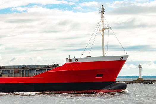 Red new cargo ship moving abroad. Product export in Europe