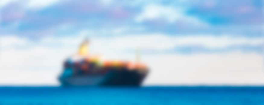 Cargo ship - soft lens bokeh image. Defocused background