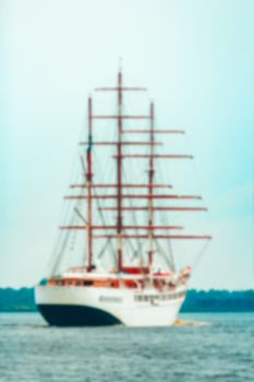 White sailing ship - soft lens bokeh image. Defocused background