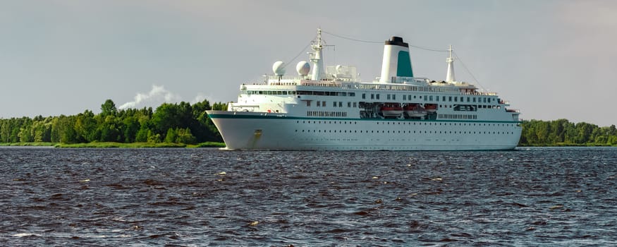 White cruise liner in Riga city. Tour travel and spa services