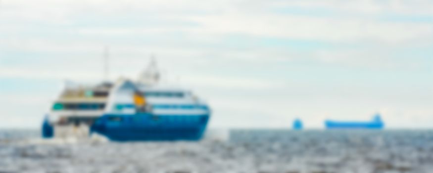 Blue passenger ship - soft lens bokeh image. Defocused background