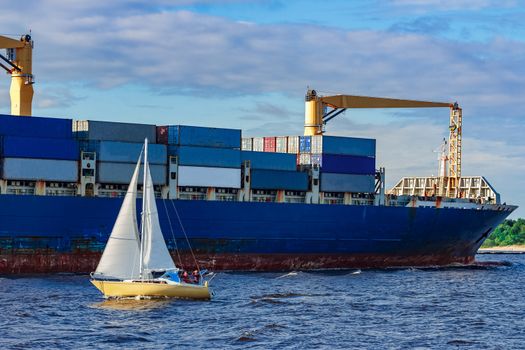 Blue container ship. World logistics and production transfer