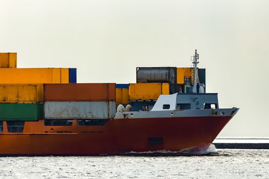 Red container ship. Logistics and production transfer