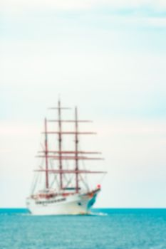 White sailing ship - soft lens bokeh image. Defocused background