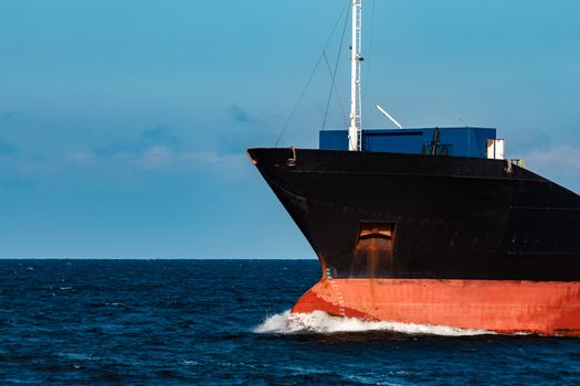 Black bulker ship. Logistics and merchandise transportations