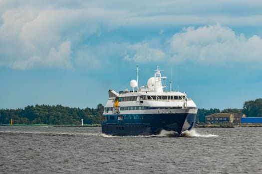 Small blue passenger ship sailing in Baltic sea. Spa services