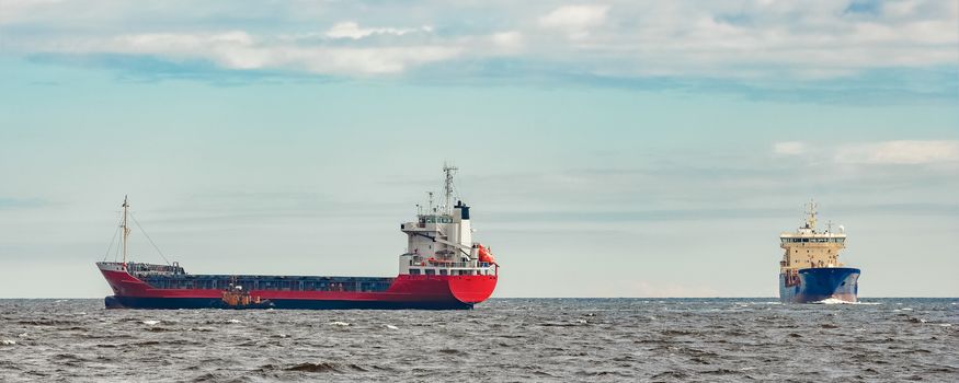 Red new cargo ship moving abroad. Product export in Europe