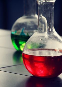 small flask with red liquid in the laboratory. a photo
