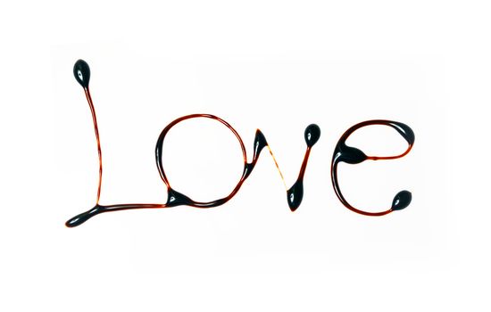 Love written with dark cocoa isolated in white