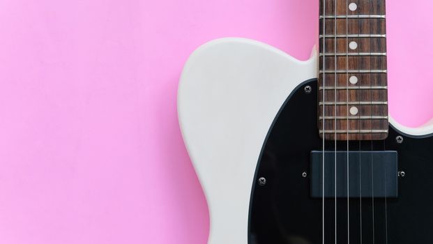 Detail of Electric Guitar on a pink background.