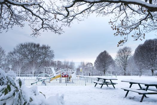 Children playground in Grove Park, Harborne is covered by snow.