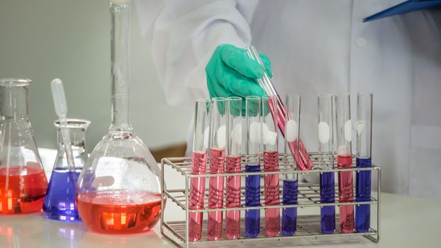 scientist with equipment and science experiments in laboratory