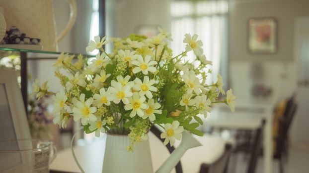 A bouquet of artificial flowers in pot