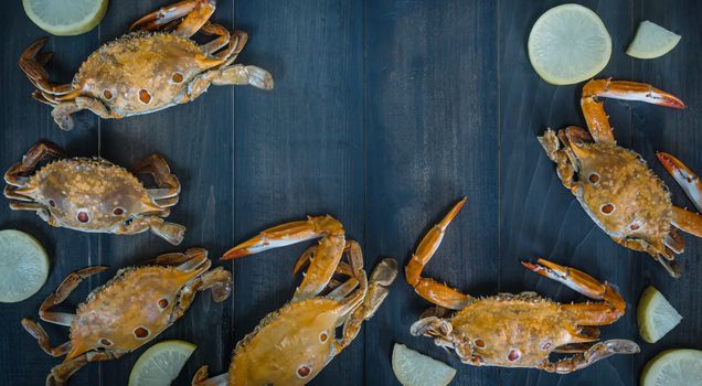 Food frame with crustacean . crab on wooden background