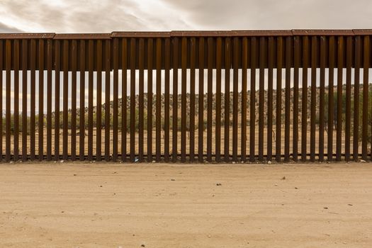 View of Mexico through international border wall at Jacumba California 
