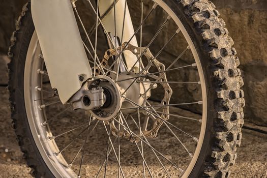 closeup of the wheel of mountain bicycle. Detail of the mountain bike. Horizontal photo. Sportive backgrounds and still-life. 