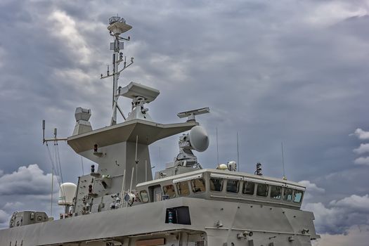 A part of military navy ship. Military sea landscape with cloudy sky